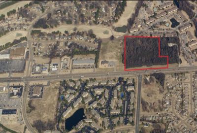 Aerial map outlining a red-bordered land parcel along Highway 64 for commercial development in the Memphis corporate real estate area.