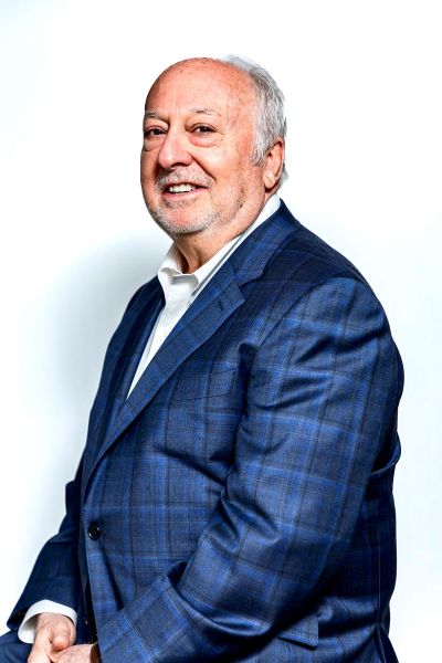 A professional headshot of Gary Makowsky specializing in the Memphis corporate real estate market, wearing a blue plaid blazer against a white background.