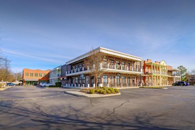 Two-story mixed-use commercial and residential loft building featuring columns and balconies in southaven ms