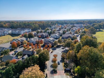Aerial drone perspective of the Westbury Apartments residential community surrounded by fall foliage