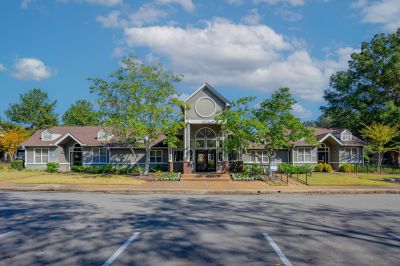 Front exterior of a multi-family clubhouse and leasing office for Champion Hills at Windyke