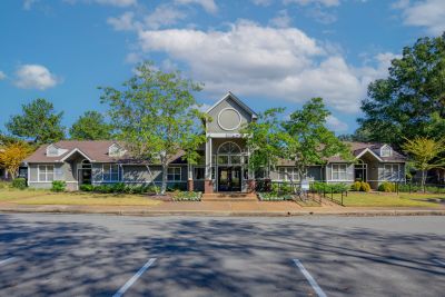 Front exterior of a multi-family clubhouse and leasing office for Champion Hills at Windyke