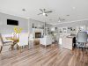 Modern leasing office and resident clubhouse lounge featuring a fireplace and hardwood flooring